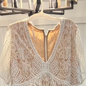 white dress tag with size cut out of it but I am a size 18/20 and fits perfect